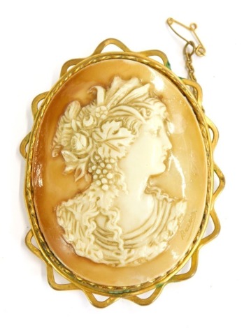 A 19thC shell cameo brooch, the painted imitation cameo depicting a maiden looking right, bearing signature Baccio, in a gold coloured plated wire work frame, 6cm x 5cm.