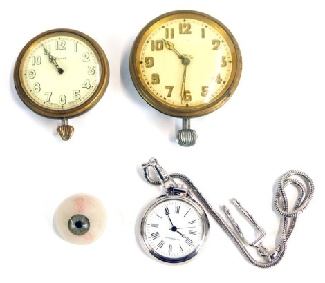 Three silver plated car clocks and pocket watches, comprising an anti-magnetic modern fob watch, an eight day stop watch, on white ceramic dial with clear numbers, and a larger example with painted numbers and cream handles, and a false eye. (4)