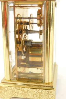 A 20thC brass carriage clock, with white Roman numeric dial, with key wind marked Worcester, with openwork movement, and scroll design case with swing handle, 11cm high. - 3