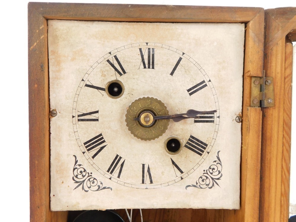 A late 19thC American faux rosewood cased mantel clock, the rectangular ...