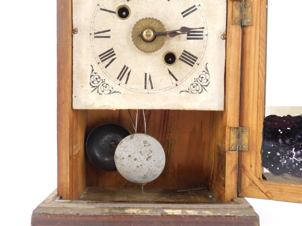 A late 19thC American faux rosewood cased mantel clock, the rectangular ...