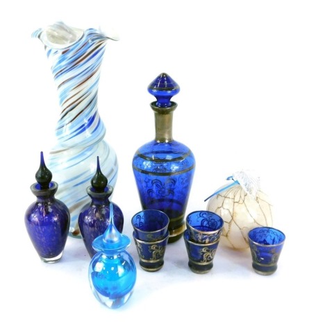 Decorative glassware, comprising an Eastern royal blue glass and silver colour highlighted decanter and five shot glasses, a flared twist stem Art Glass vase, 33cm high, two decorative purple and gold aventurine scent bottles and stoppers, 25cm high, a bl