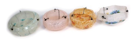 Four 1940's/1965's light shades, comprising a white and orange mottled example, a white floral painted example, pink mottled example and another, each with brass hanging chain.