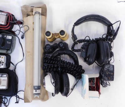 Audio and technics equipment, comprising a pair of plastic cased opera glasses, two sets of headphones, a Lima Rocket tester, a Pullman flash, One Four Digibox, modern cameras, cased binoculars, projector, etc. (1 box) WARNING! This lot contains untested - 4