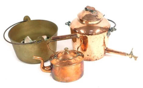 A group of copper and brass wares, comprising a Victorian copper kettle, copper tea urn and a brass jam pan. (3)