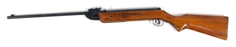 A model 55 air rifle, stamped Shanghai China, on a wooden barrel, .22 calibre, 106cm long.