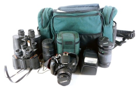 A group of camera equipment, comprising a Canon EOS650D camera, auto focus zoom lens, charger, Speedlite 430EXII electronic flash, carry bag, Sigma 70-300mm APO Macro super lens, together with three pairs of binoculars (a quantity)