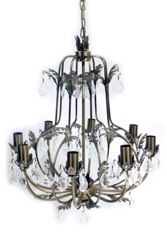 A bronzed finish eight branch chandelier, with crystal droplets and cast with leaves, 50cm high.