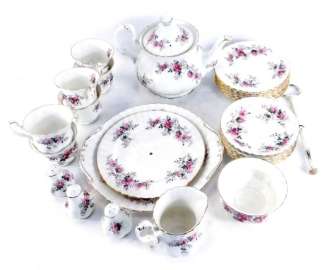 A Royal Albert Lavender Rose pattern porcelain part tea service, comprising teapot, six cups and saucers, milk jug, sugar bowl, three salt and pepper pots, cake stand, dinner plate, and six side plates.