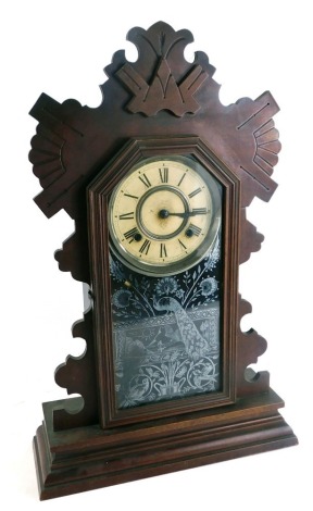 A late 19thC Ansonia Clock Company mantel clock, with a fluted and carved top, with single glazed panel door, depicting peacock and birds, on a cream Roman numeric dial, with eight day movement and coil strike, 58cm high, 34cm wide, 12cm deep.