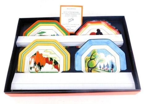 A Wedgwood Bizarre by Clarice Cliff presentation plate set, comprising four octagonal plates, May Avenue, Orange Roof Cottage, Solitude, and Farm House, boxed with limited edition certificate 420/1000.