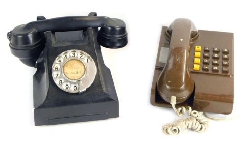 A Siemens of London black Bakelite dial telephone, number for London 87, and a brown wall mounted telephone, circa 1960's. (2)