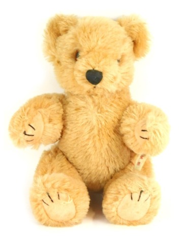 A Japanese pure wool plush blonde jointed Teddy Bear, bearing label, 20cm high.