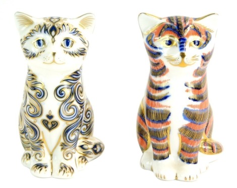 Two Royal Crown Derby cat paperweights, comprising Majestic Kitten, limited edition 234/5000, with gold stopper, and a further standing kitten with gold stopper. (2)