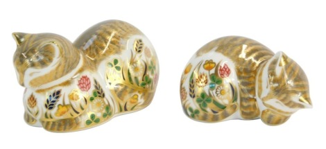 Two Royal Crown Derby cat paperweights, comprising Cottage Garden Cat seated and Cottage Garden Kitten curled, each with a gold 21 Year stopper. (2)