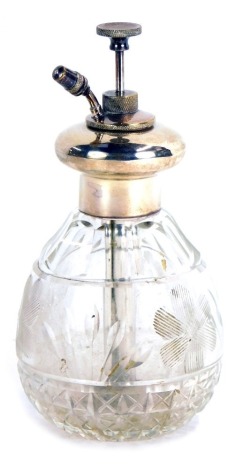 A George V silver and cut glass atomiser, with a push stem on a faceted glass bowl, Mappin & Webb, Birmingham 1923, 15cm high.