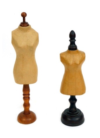 Two table top dress makers dummies, possibly for doll's clothes, each on turned wooden bases, 37cm and 39cm high respectively. (2)