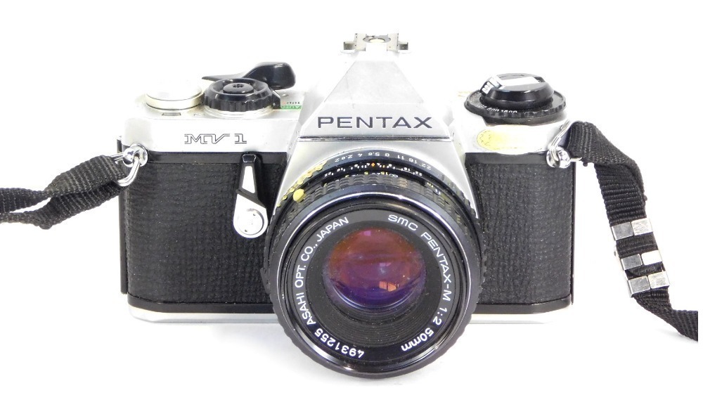 A Pentax MV1 camera with a Pentax 1-2 50mm lens.