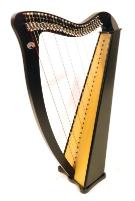 A French Camac harp, in a fitted case, 85cm long.