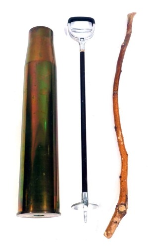 A brass shell case stick stand, with walking stick and shooting stick, 73cm high.