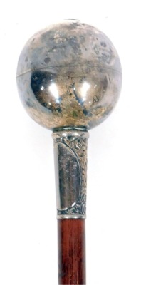 A Drum Major's baton or ceremonial mace, with a silver plated floral scroll top, on a painted pine base, with brass cap end and red strung detail, 140cm long.