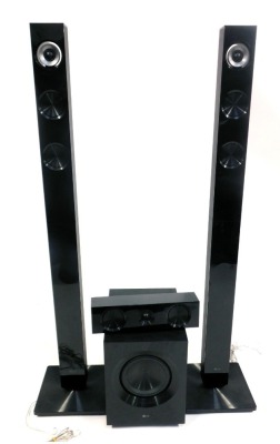 An LG home sound system, codel S72T1-s, comprising two tall speakers, a box speaker, and sound bar. (4)