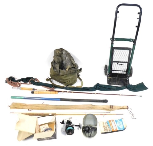 A group of fishing equipment, comprising a trolley, a Mitchell 387 Garcia reel, fishing bag, two unbranded rods, etc. (a quantity)