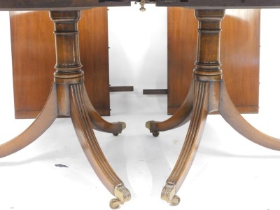 A mahogany twin pedestal dining table in the Regency style, with parquetry banding on out splayed legs, 73cm high, 160cm wide, 104cm deep, with two additional leaves. - 3