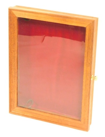 A mahogany framed table top collector's cabinet, with red baize lining, 7cm high, 49cm x 40cm.