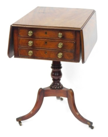 A 19thC flame mahogany sewing table, with fall flaps, and three pull out drawers, with brass cap ends terminating in castors, 74cm high, 43cm wide, 57cm deep.