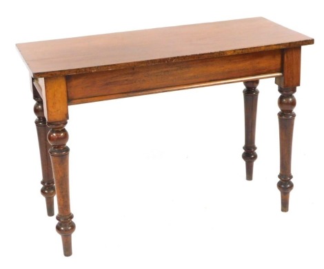 A mahogany serving or console table, with rectangular top on turned tapering legs, 74cm high, 107cm wide, 44cm deep.