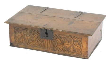 A late 17thC/early 18thC oak bible box, with fan and floral carving, with an iron lock plate, 20cm high, 65cm wide, 38cm deep.