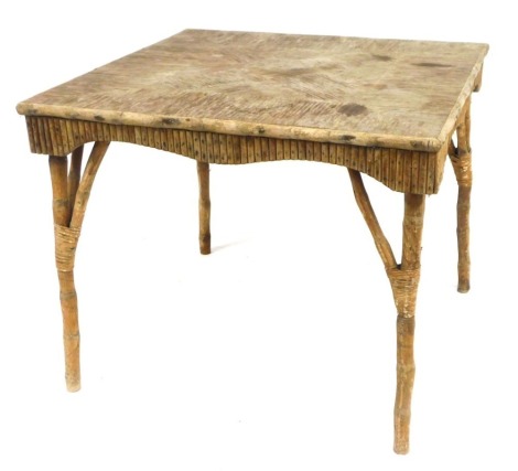 A bamboo table, the square set top on arrangement of bamboo columned supports, 74cm high, the top 92cm x 92cm.