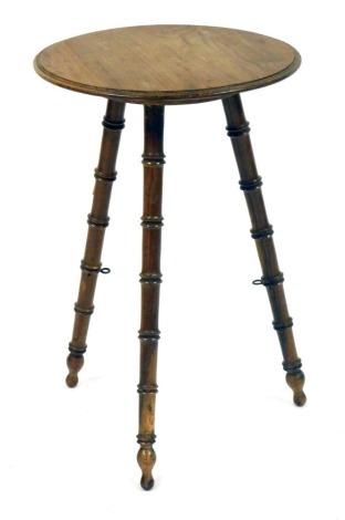 A 19thC walnut Gypsy table, the circular top on bobbin turned tripod base, 60cm high, 38cm diameter.