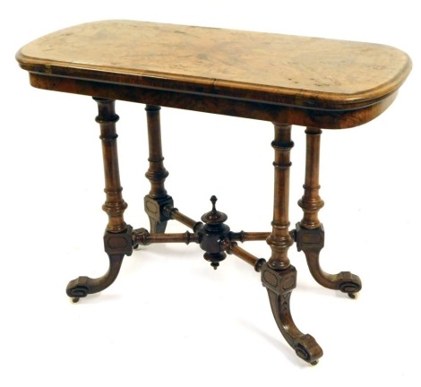 A Victorian walnut tea table, the rectangular folding top with rounded corners, on X frame base with out scrolled cabriole legs, 73cm high, 91cm wide, 48cm deep.