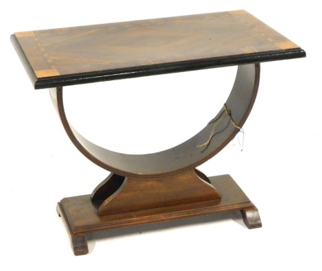 A walnut Art Deco side table, with a rectangular parquetry top, on a U shaped rectangular foot, 57cm high, 76cm wide, 44cm deep.