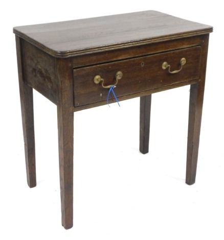 An oak side table, the rectangular top with rounded and reeded corners, above single drawer on square taper legs, 78cm high, 73cm wide, 46cm deep.