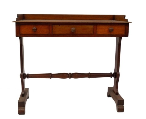 A Victorian mahogany washstand, with three frieze drawers, slab supports joined by a turned stretcher, on platforms with scroll feet, 76cm high, 92cm wide, 46cm deep.