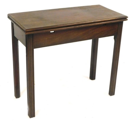 A 19thC mahogany tea table, the rectangular fold over top on reeded taper legs, 73cm high, 85cm wide, 40cm deep.