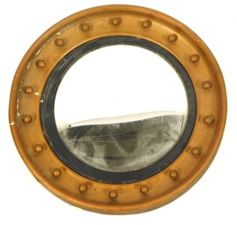 A gilt convex wall mirror, 52cm diameter. (AF)