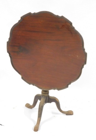 A mahogany piecrust tilt top table, on twisted column tripod base, terminating in ball and claw feet, 78cm high, 82cm wide, 82cm deep.