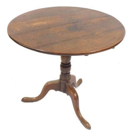 A 19thC oak tilt top table, on tripod base, 73cm high, the top 84cm diameter.