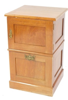 A teak two door bedside, with a pull out cupboard top, and fall flap base, 76cm high, 48cm wide, 44cm deep.