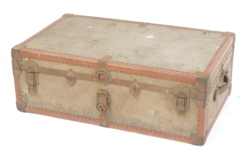 A canvas bound and metal lined trunk, bearing initials J W M C D, 32cm high, 91cm wide, 52cm deep.