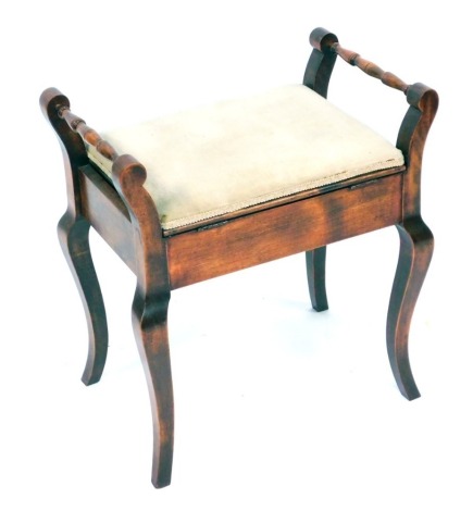 An Edwardian beech piano stool, with out splayed legs, cream upholstered seat, 60cm high, 54cm wide, 34cm deep.