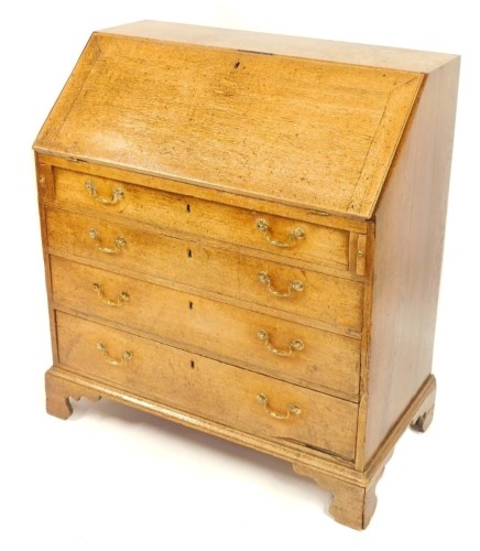 A 19thC oak bureau, the fall flap above arrangement of four drawers, with brass swing handles, on bracket feet, 105cm high, 95cm wide, 50cm deep.