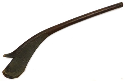 A 19thC Fijian Kiakavo gunstock war club, of dense hardwood, the flattened edge carved with cross hatching interspersed with bands of chevrons, on a curved shaft terminating in a flared grip, 114cm wide. (AF) - 10