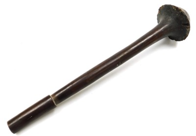 A 19thC New Caledonian Melanesia Kanak war club, of dense hardwood with a mushroom shaped phallic head, and a tapering cylindrical shaft, terminating in an expanded flange grip, 70cm wide. (AF) - 11