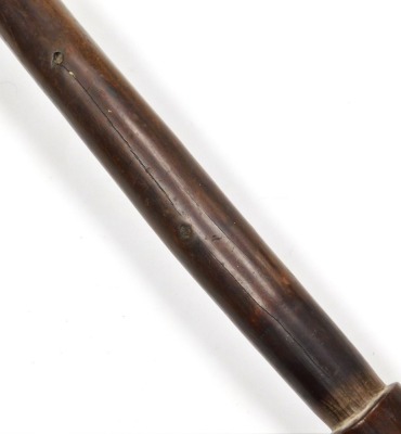 A 19thC New Caledonian Melanesia Kanak war club, of dense hardwood with a mushroom shaped phallic head, and a tapering cylindrical shaft, terminating in an expanded flange grip, 70cm wide. (AF) - 17