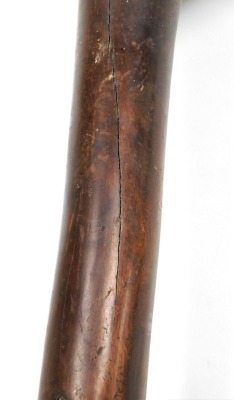 A 19thC New Caledonian Melanesia Kanak war club, of dense hardwood with a mushroom shaped phallic head, and a tapering cylindrical shaft, terminating in an expanded flange grip, 70cm wide. (AF) - 18